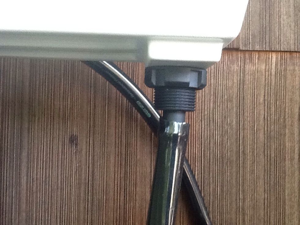 Then drill a hole in both sides of your garden bed that is big enough to fit your drains. Then put your drains in and make sure your side that drains the water is screwed in all the way.