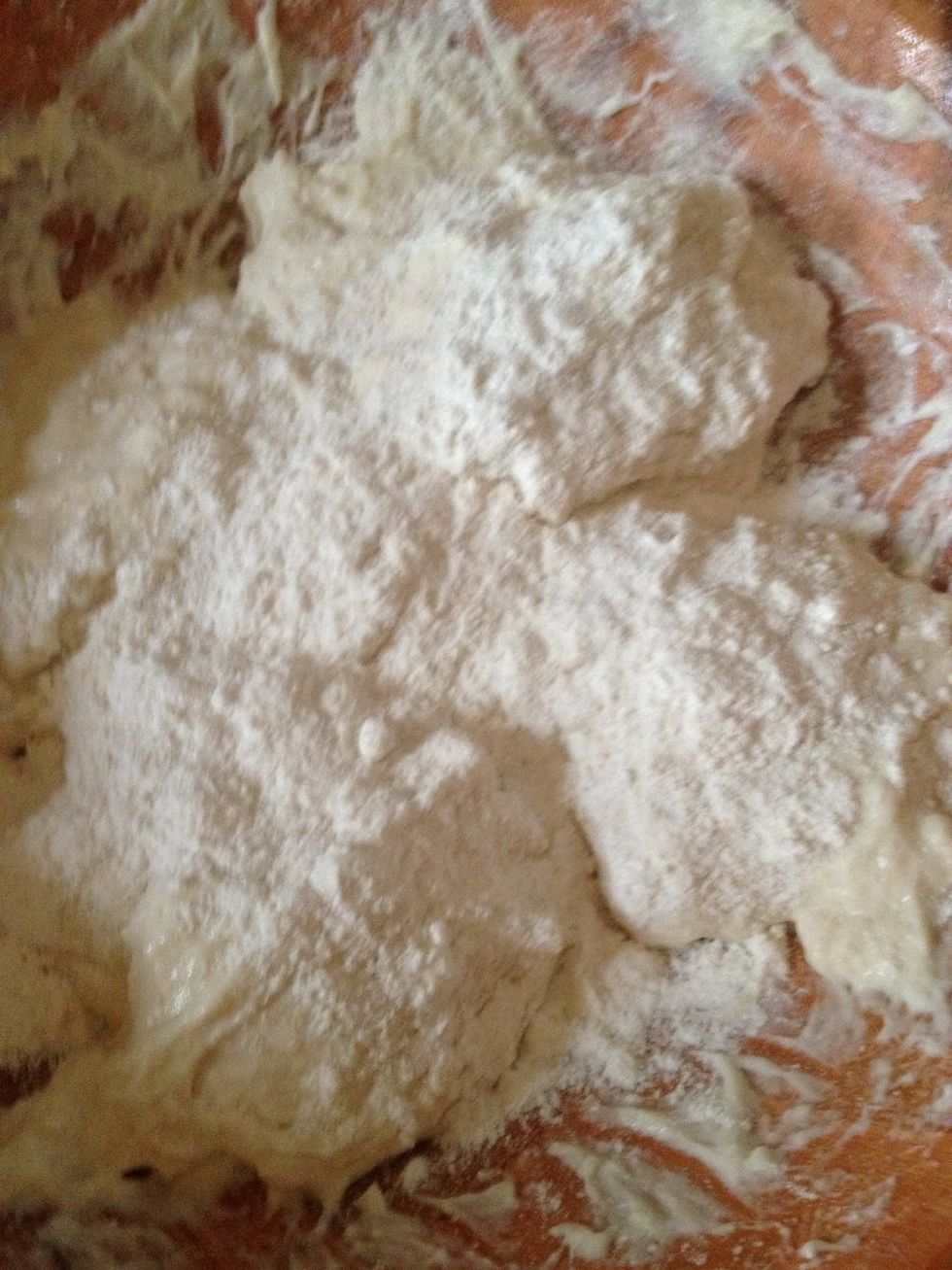 Then dust all purpose flour over the balls it's very sticky this is the hard part grab the ball