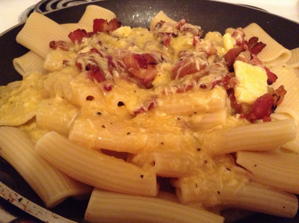 Then egg mixture and - this is important! - some of the water used to cook the pasta in (NOT cream) to make the egg mixture cook as a cream, not scrambled eggs!