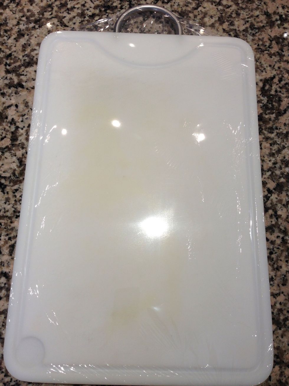 Then envelope a big cutting board with the cling film. Or use a breakfast table. Anyway spreading any dough between 2 cling film sheets is very practical