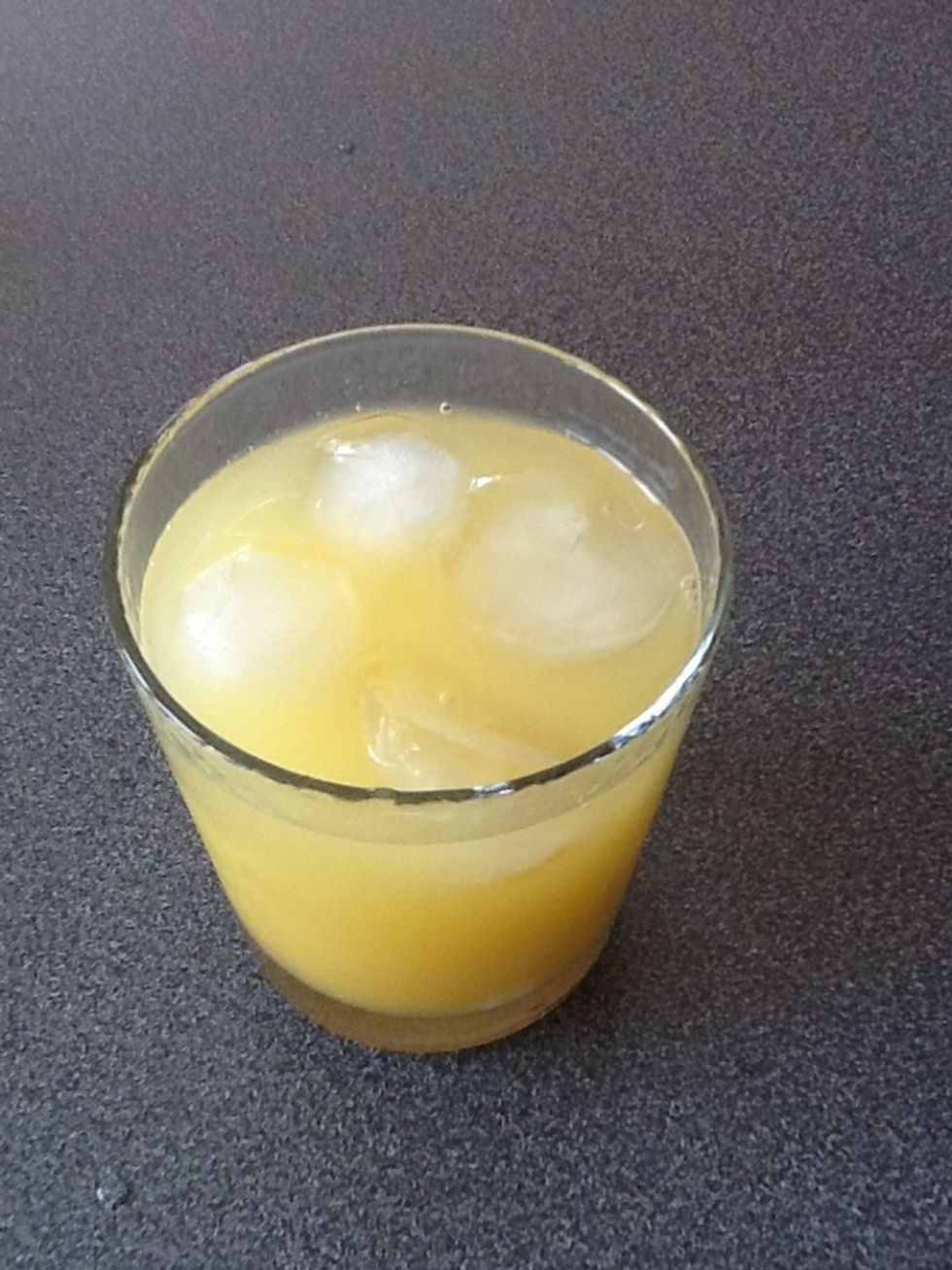 Then finally fill the rest of the glass with water, stirring it once more.