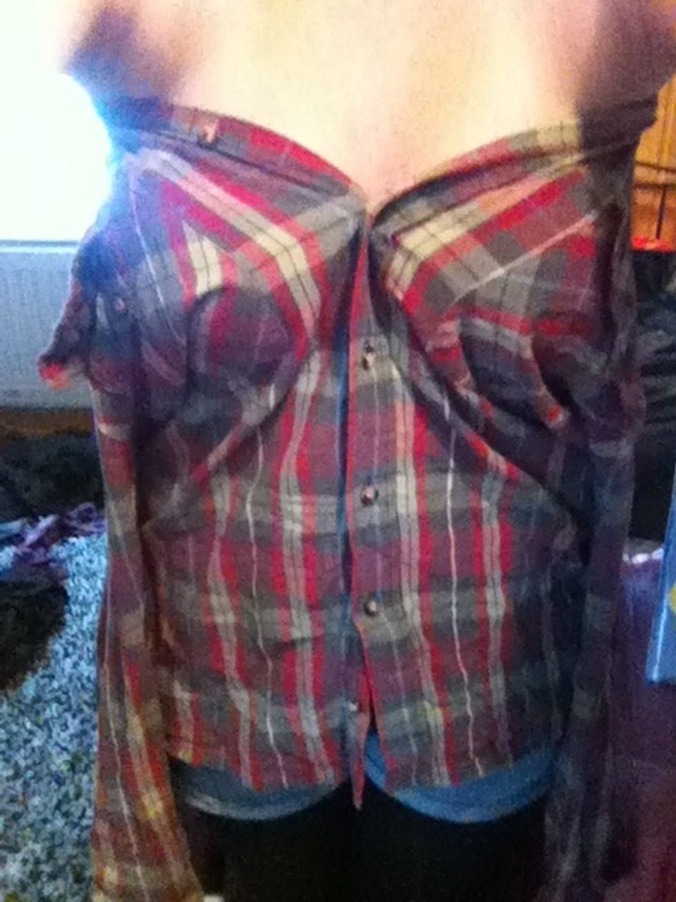 Then find a shirt button that fits good on you. (for me it was the fourth from the top) then you fasten the buttons all the way down (Im sorry for really bad English)