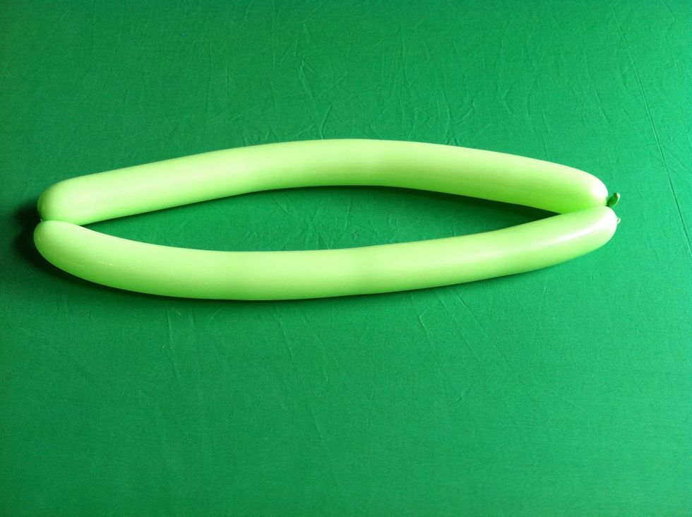 Then find the center, squeeze and rotate one side so that it looks like a pair of lips