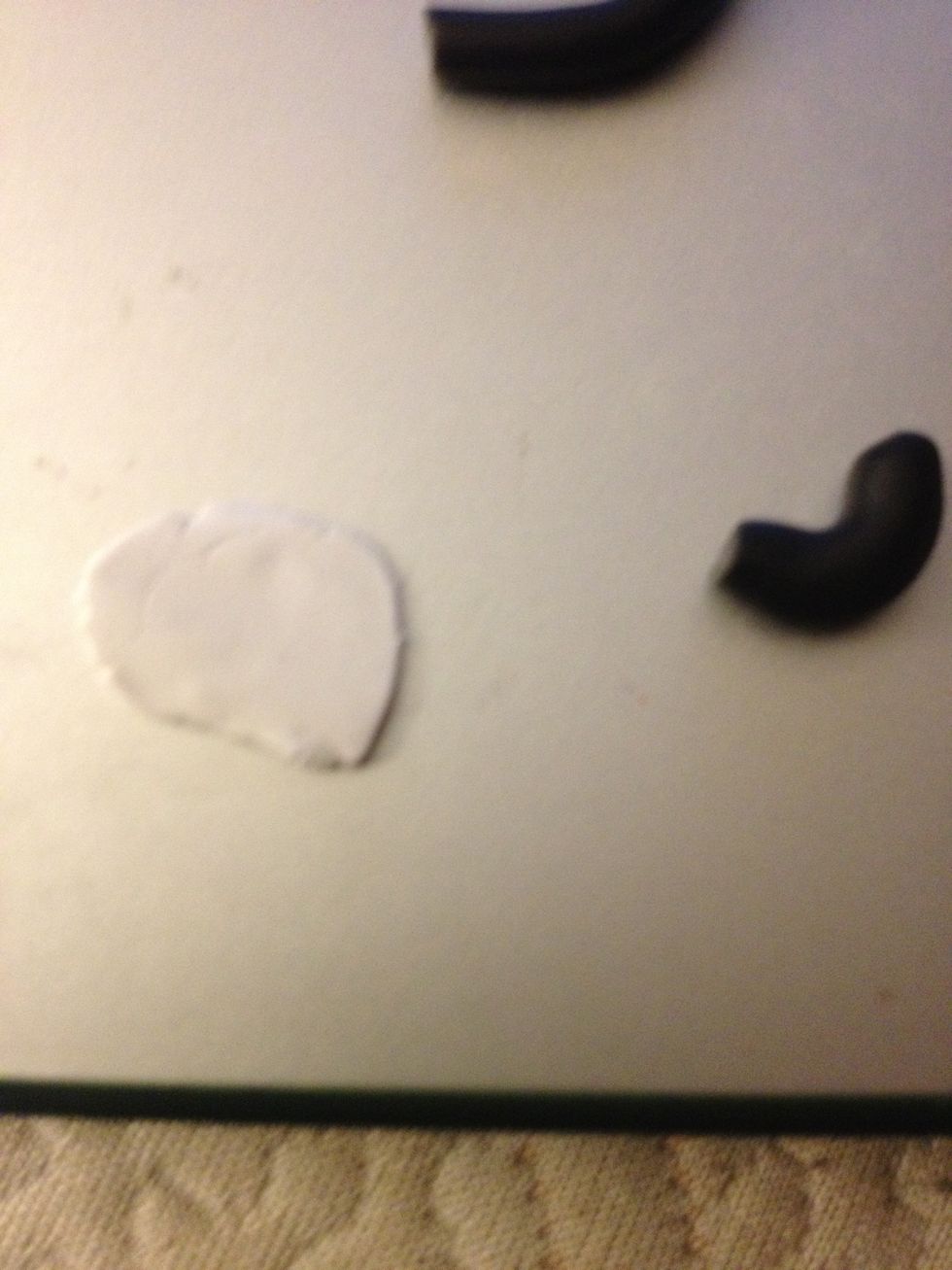 Then flatten out the white ball. This will be for the tape on the bridge.