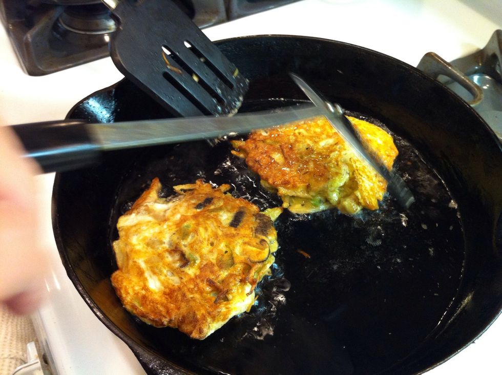 Then flip the pancake but use the other spatula to keep the pancake from splashing into the oil. I splattered oil the first time, after a few you'll get the hang of it.