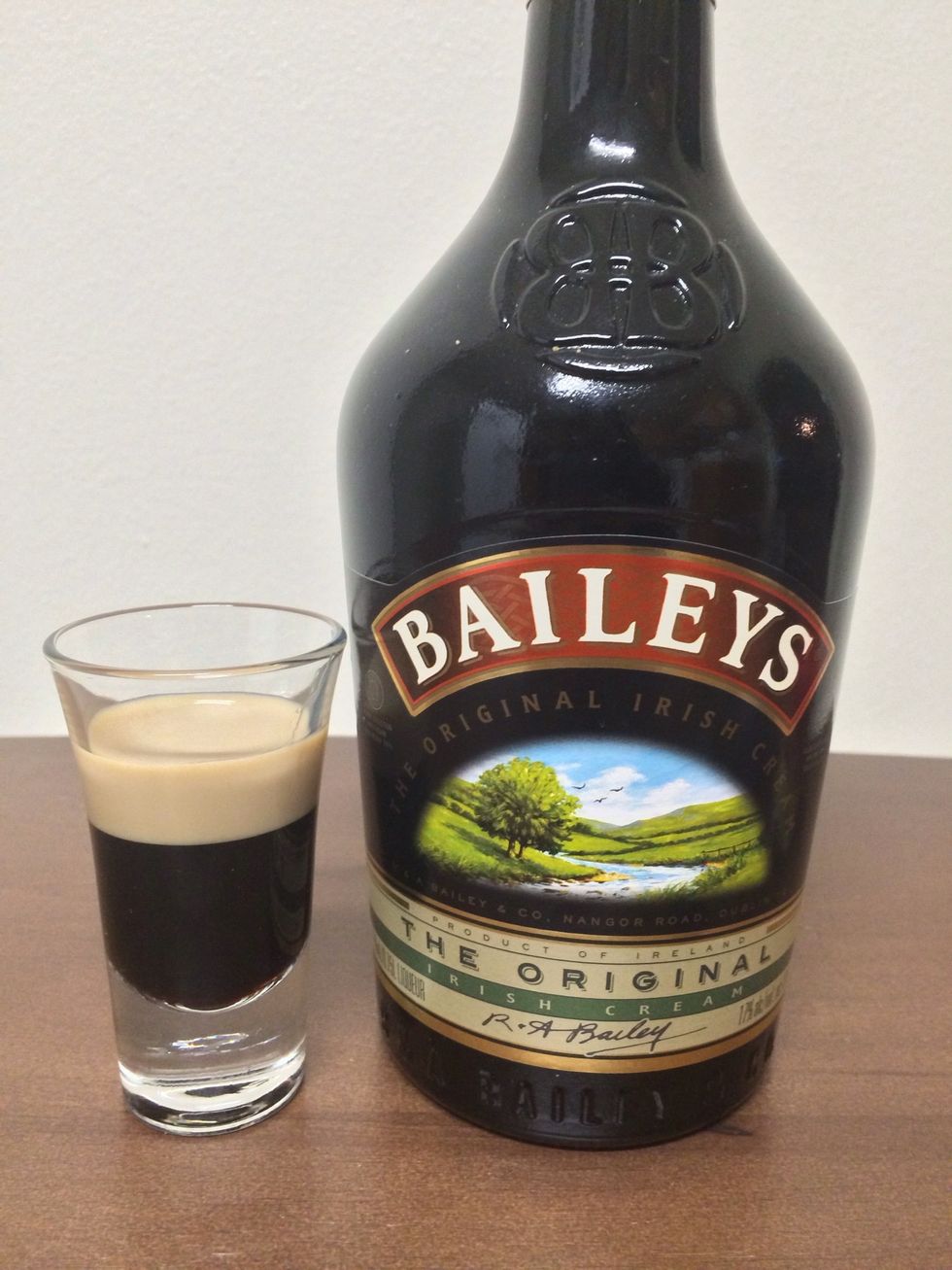 Then, float an ounce of Bailey's Cream on top of the Kahl\u00faa. *Note: pour slowly down the side of the glass.