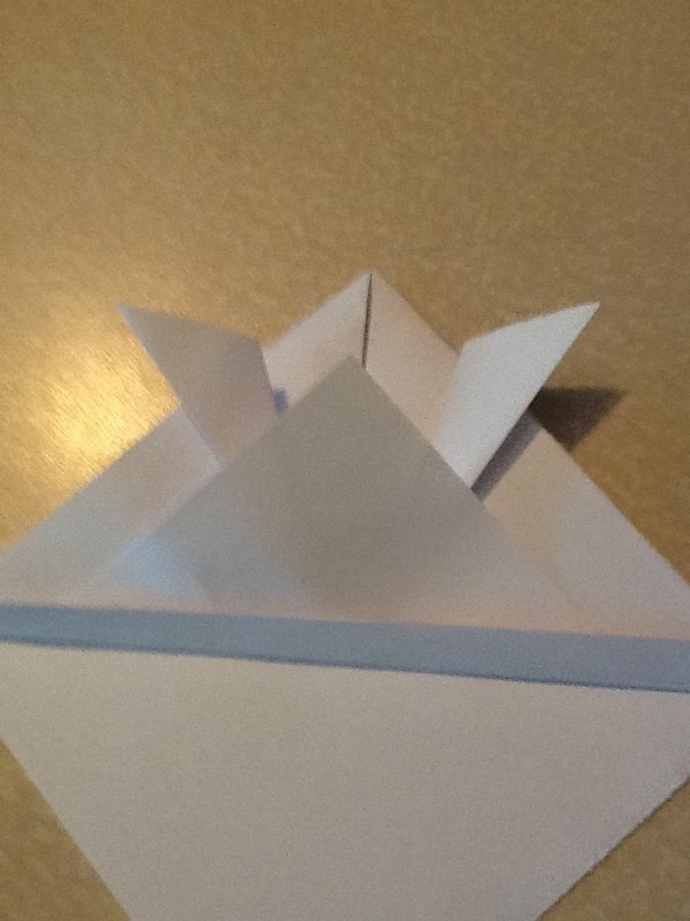 Then fold excess paper up again