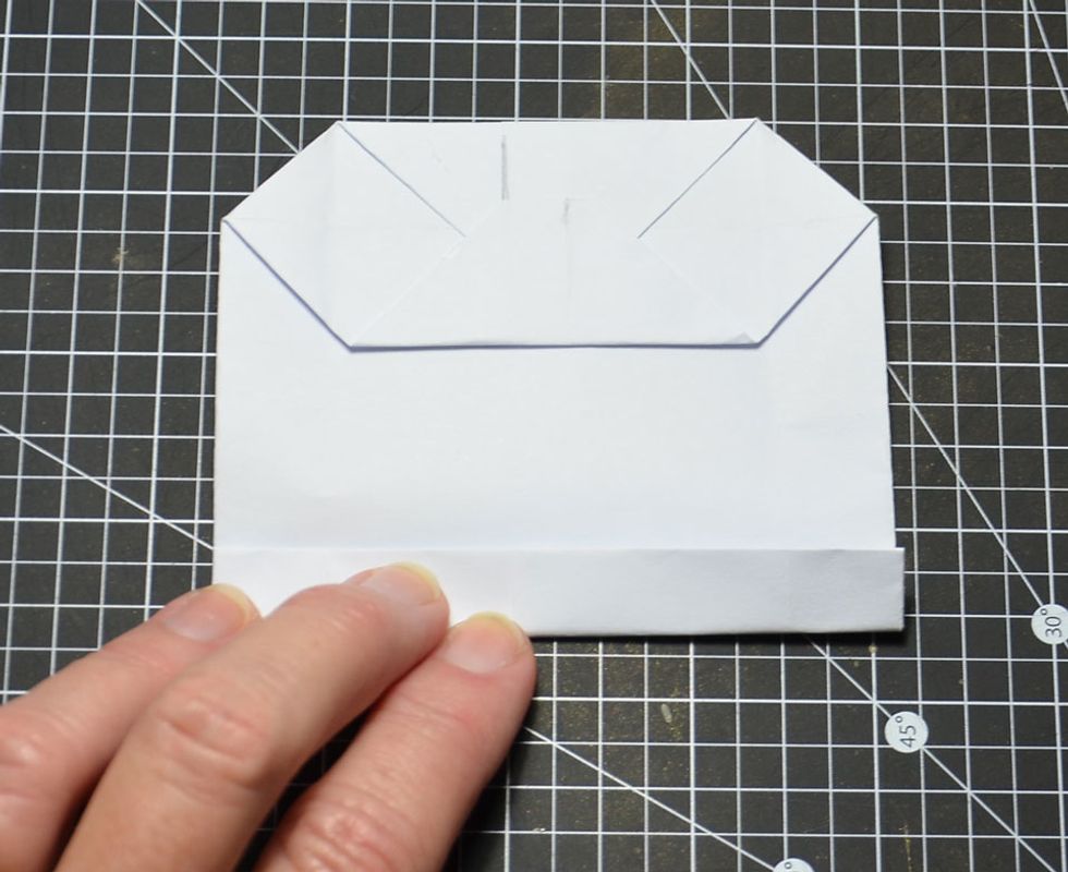 Then fold in half again as shown.