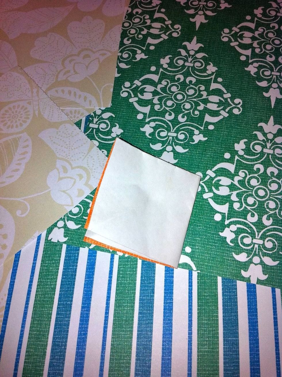 Then fold in half again lengthwise so you have another square. Don't worry about matching up the edges perfectly, just get close-ish.