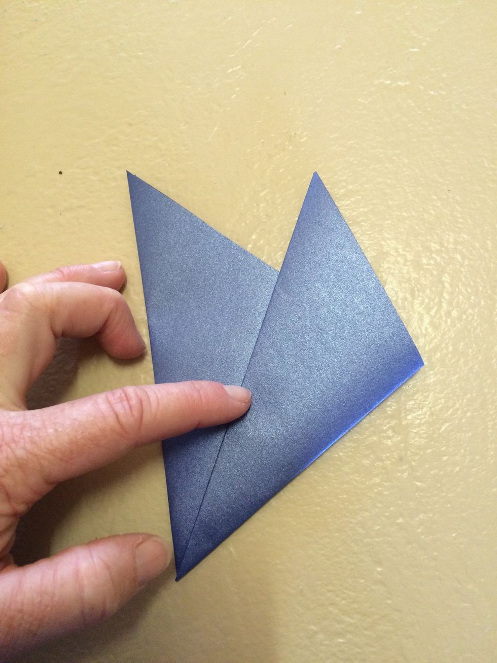Then fold in thirds. Until both folds are equal. Press edge firmly