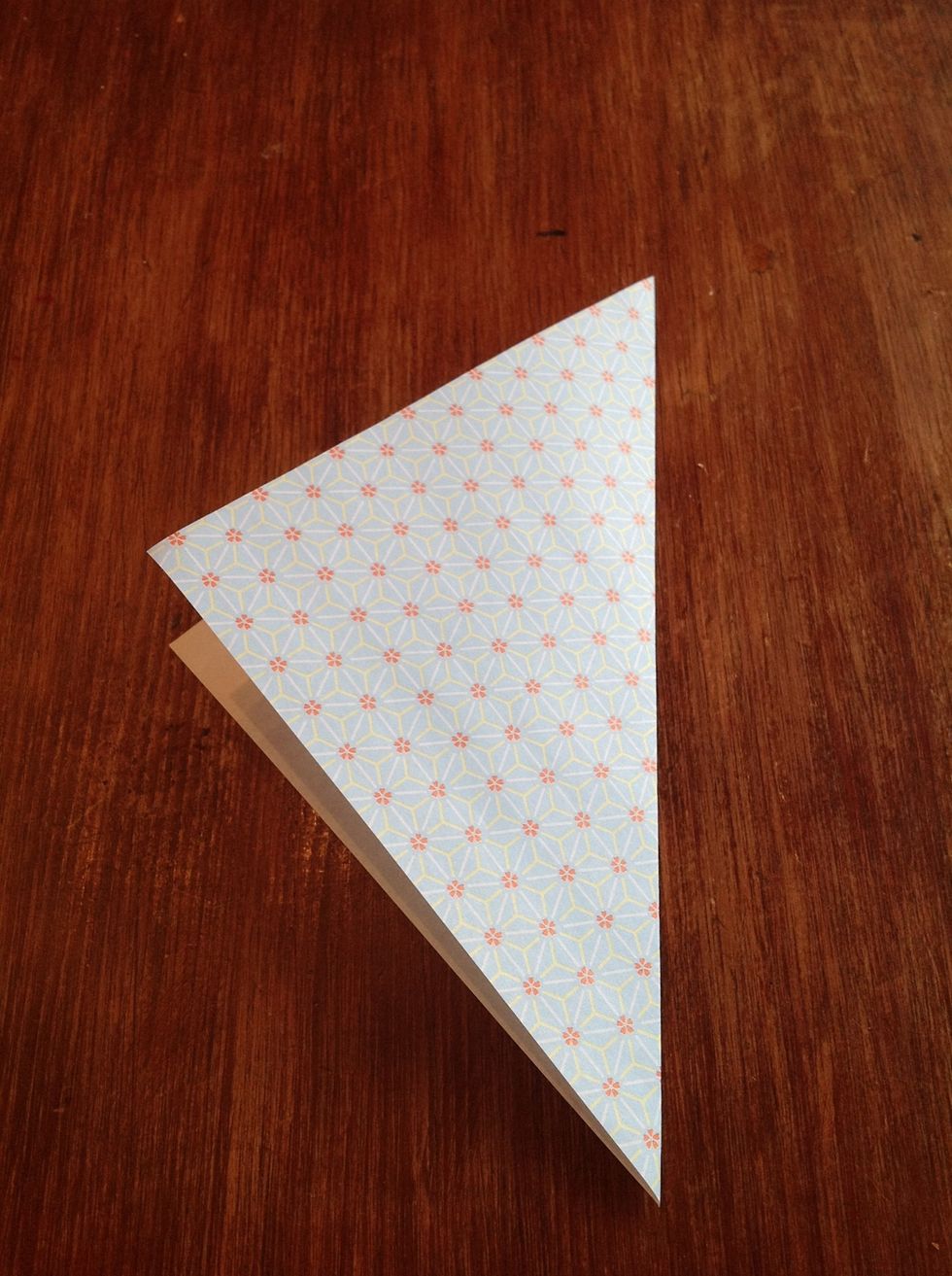 Then fold it into a triangle