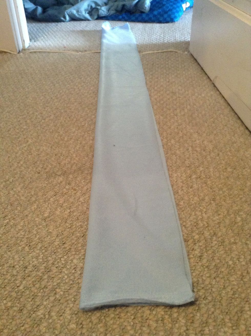 Then fold it the long way (hot dog style). Now the back of the fabric should be showing.