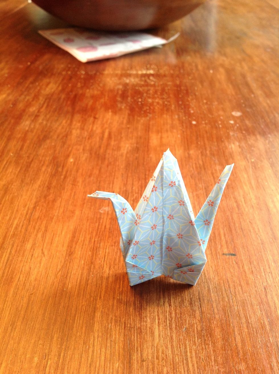 Then fold one side into a beak