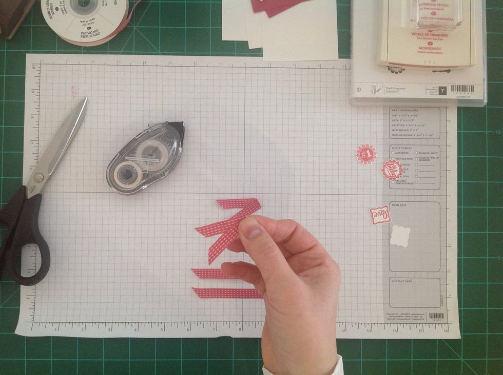 Then fold over (so the adhesive sticks together) to make a ribbon tail.