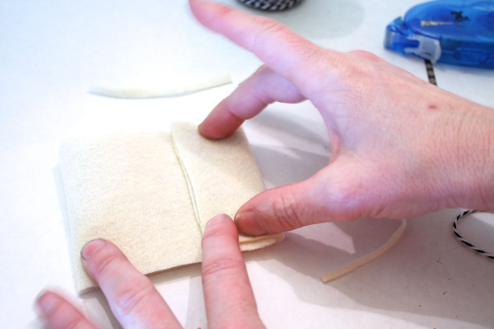 then fold that edge over the top- press firmly- if you find any of your paper sticks out or felt hangs over just trim it- no biggie