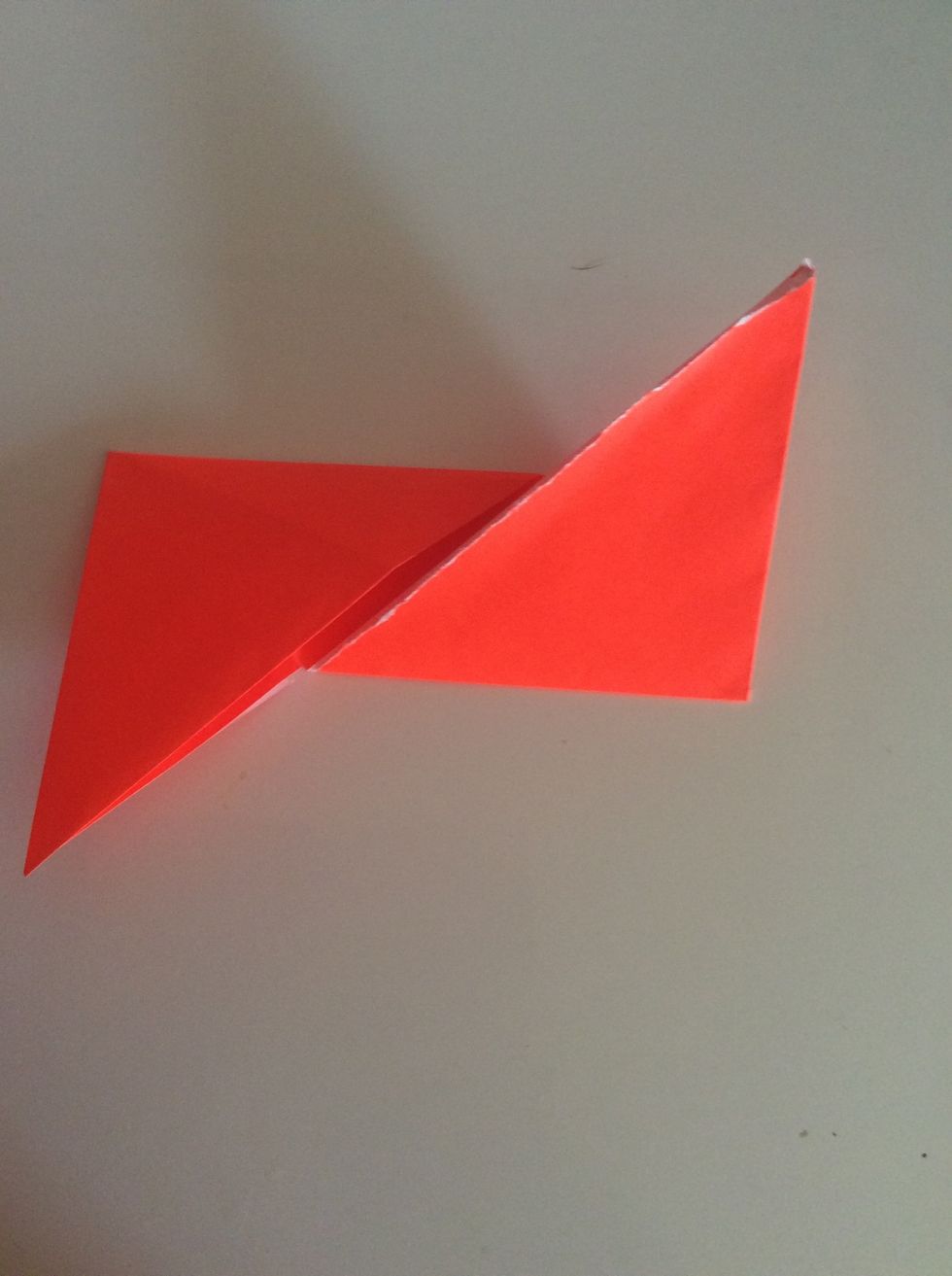 Then fold the corner that went up, down, and the one that went down, up.