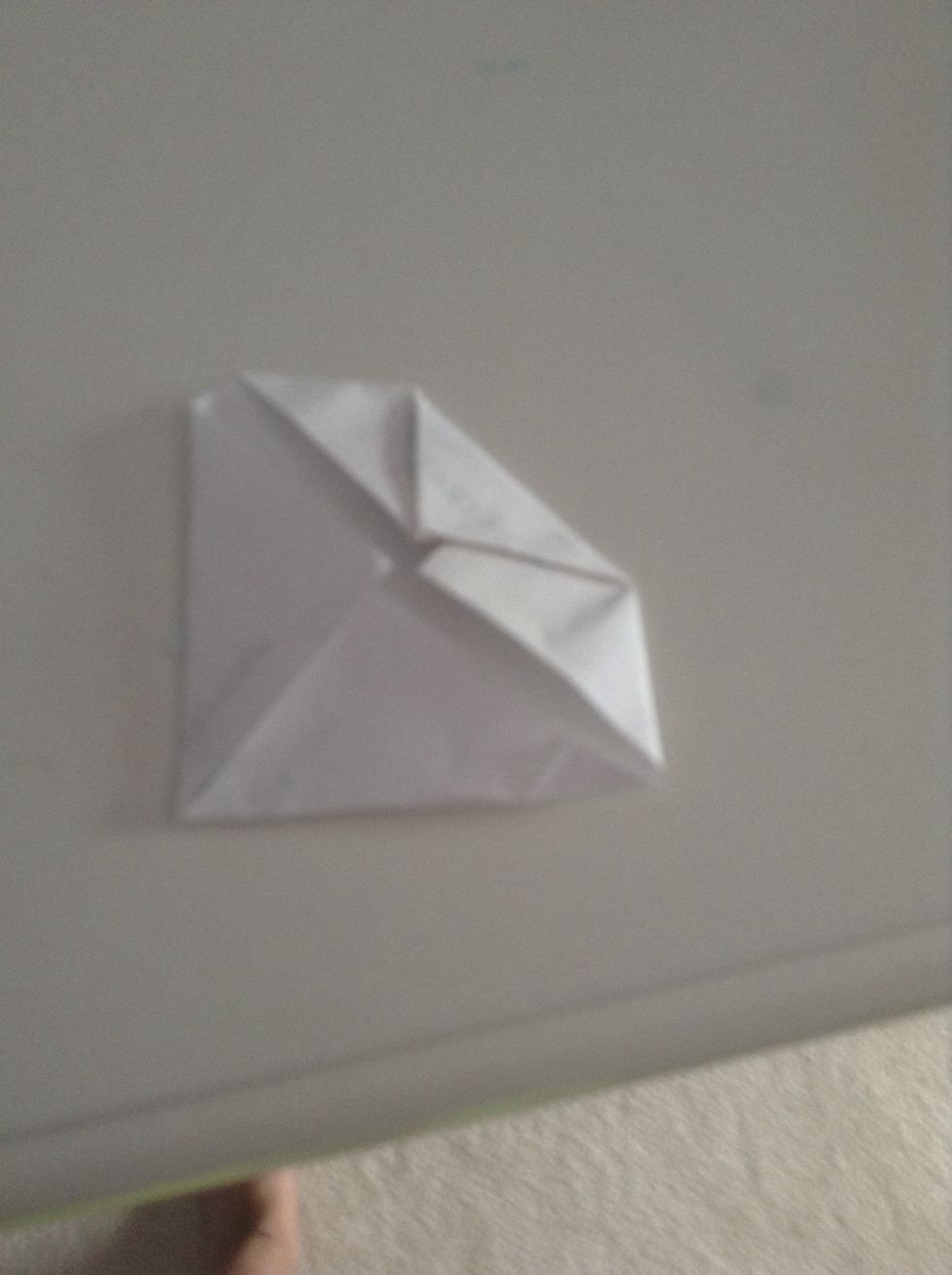 Then fold the corners again to the middle.