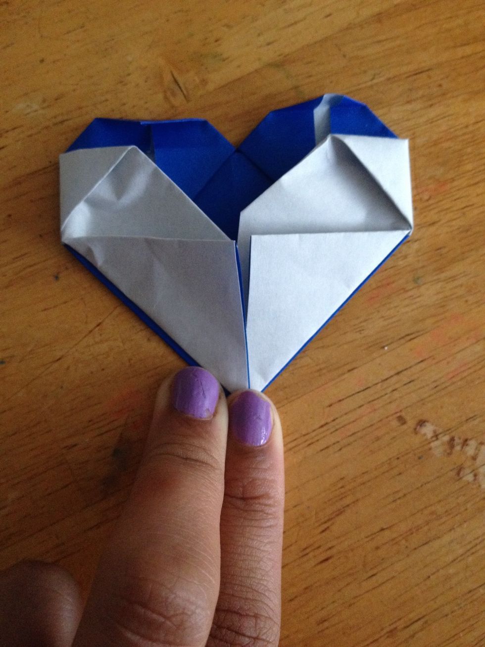 Then fold the outside of the flaps over to the middle. You can put some tape to hold it if you want.