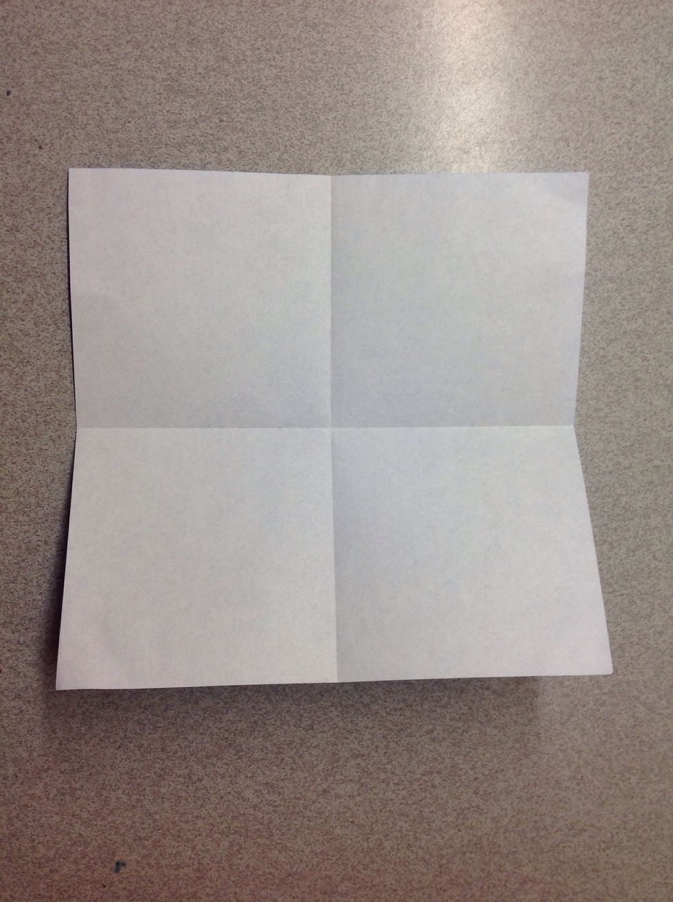 Then, fold the paper in half vertically (then unfold) to divide the paper into fourths.