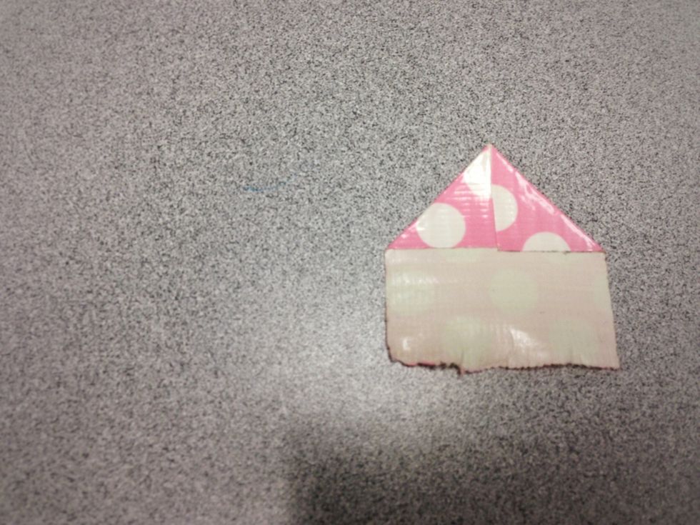Then fold the right upper hand corner to align with the other half you have already folded.