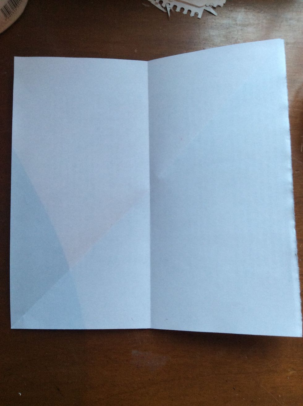 Then fold the square in a half.