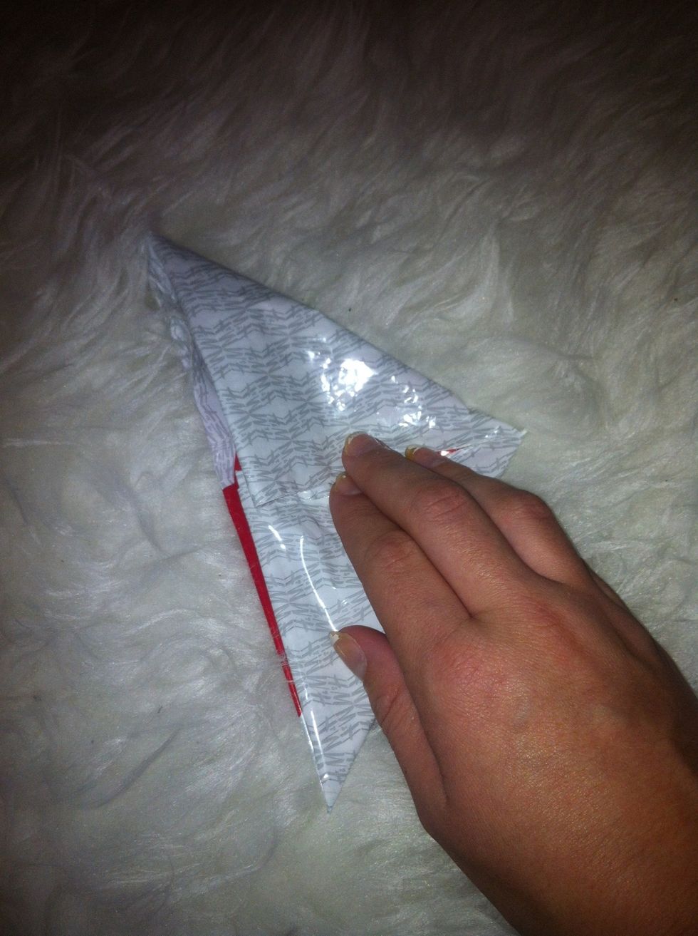 Then fold the square into a triangle, just like you did the first time.