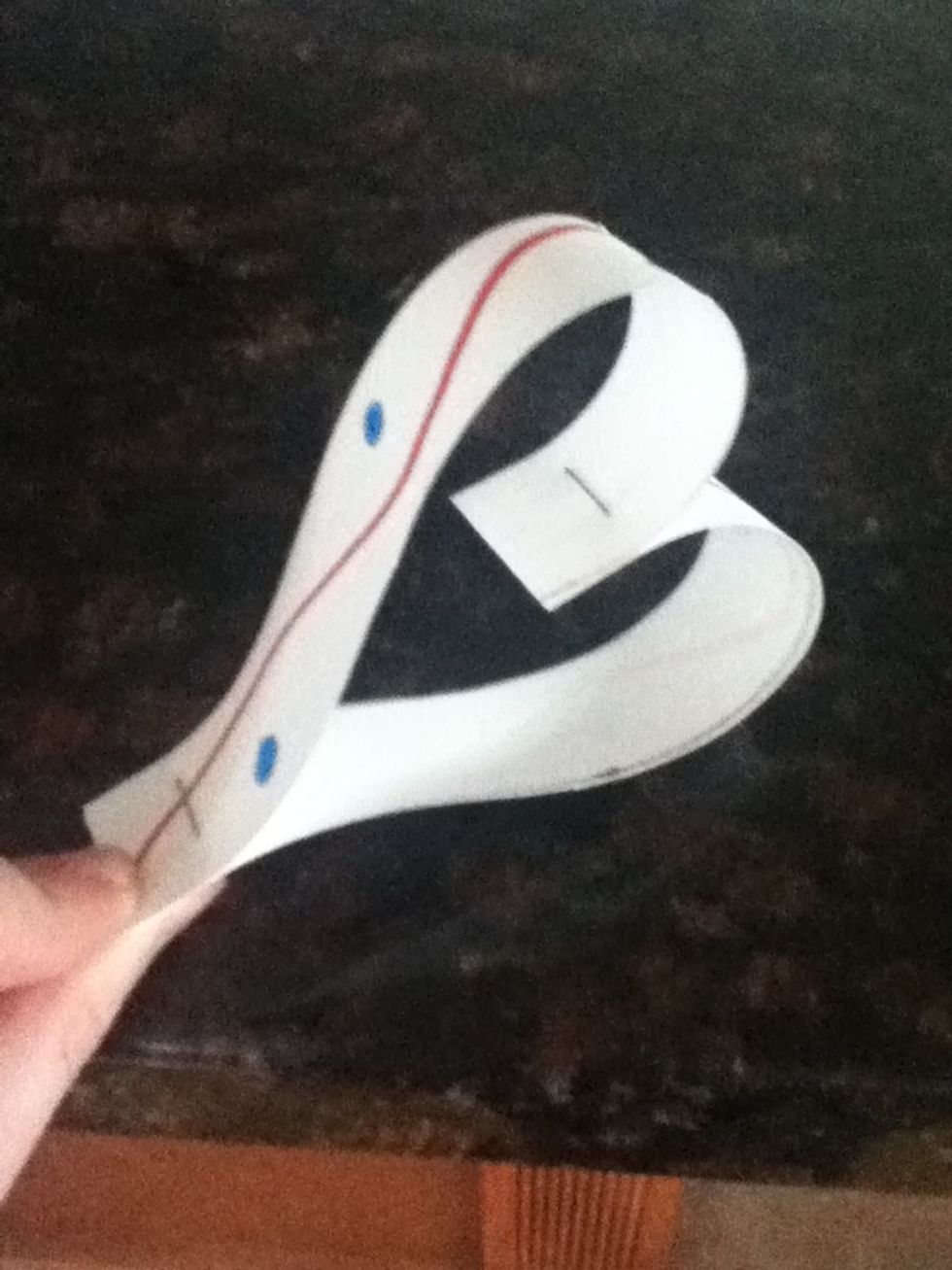 Then fold the the strips around the staple and put another staple at the bottom