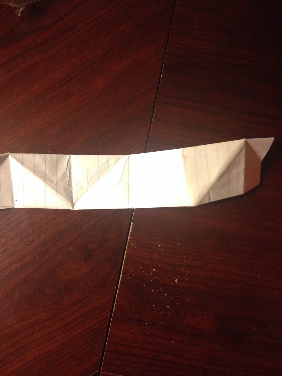 Then fold the top half down again as shown