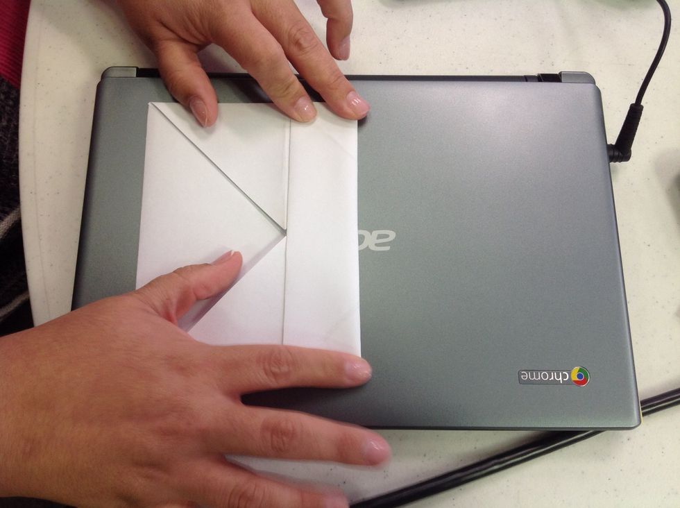 Then, fold the top to the middle.