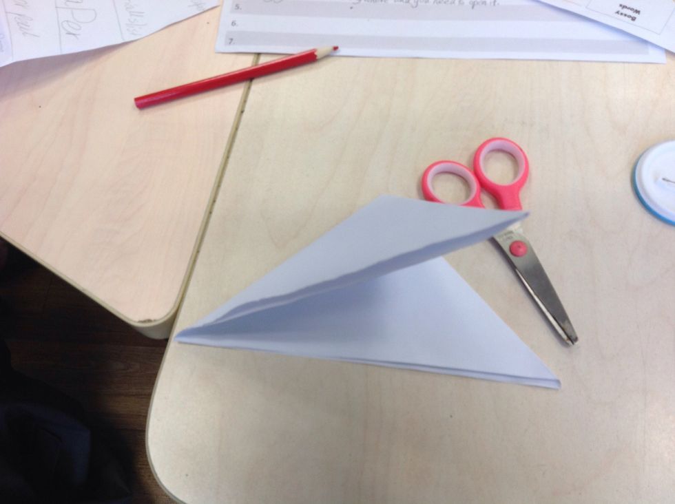 Then fold the triangle to another little triangle.