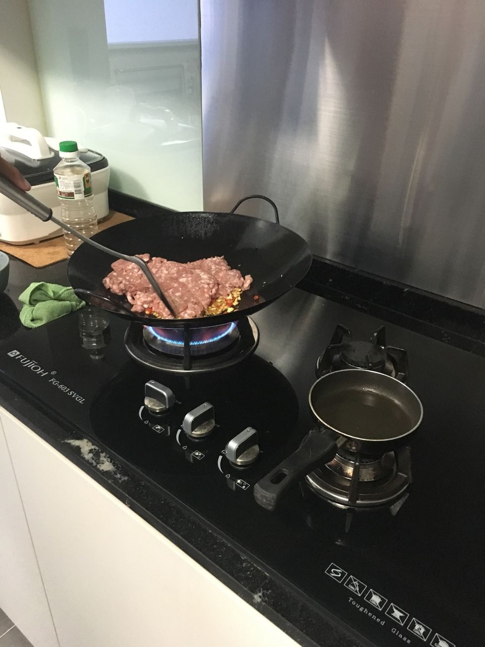 Then followed by adding in the minced pork meat in and give it a good fry.