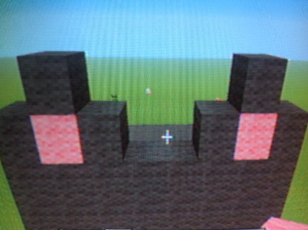 Then for ears use pink in middle of the ears and three gray blocks around it .