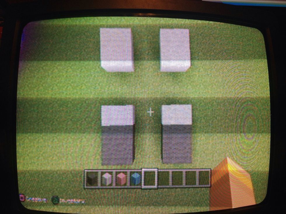 Then for the back legs put 2 white blocks and then put four gray blocks next to white blocks .