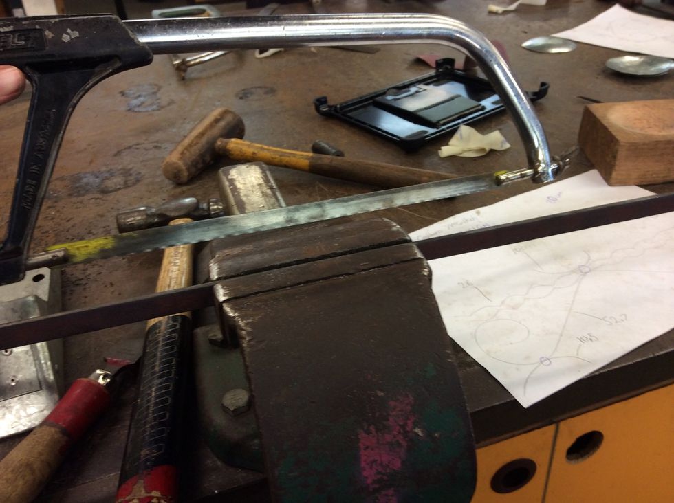 Then get a long strip of metal and get a hacksaw and cut two pieces to the size you want it.