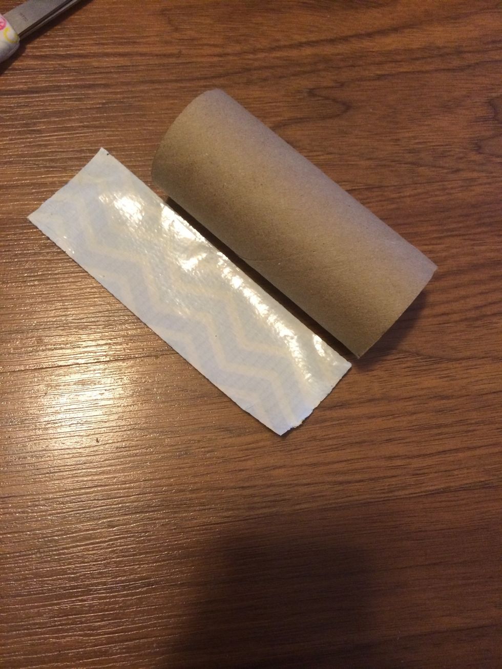 Then, get a piece of duct tape that fits around the roll.