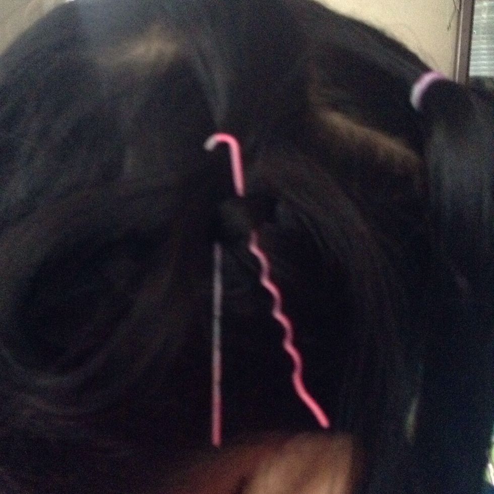 Then get a piece of hair that you divided and put it through the bobby pin