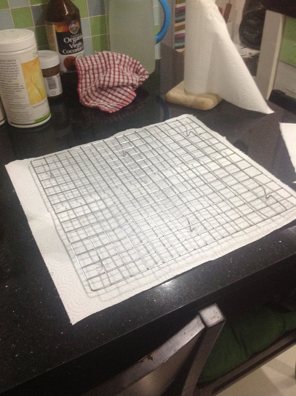 Then get a wire rack and place some paper towel underneath it.