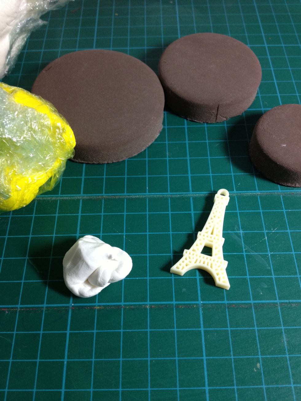 Then, get all the materials ready. Mix a light yellow clay to match the color of the Paris Tower Cabochon.