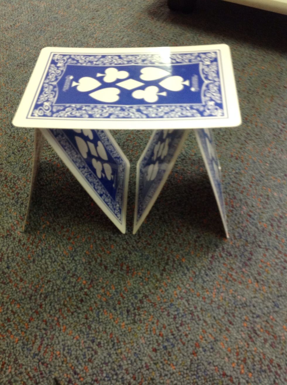 Then get one cards and put on top of the cards you just put down