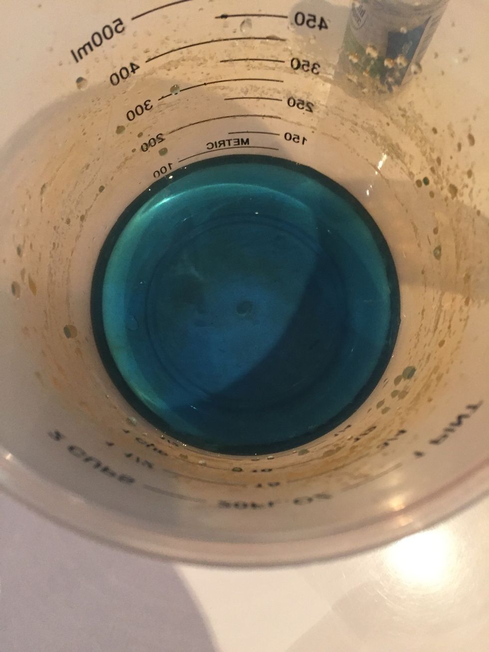 Then get some water from the tap and add in quite a lot of blue food colouring so it showes up when you put it in the glass bottle.