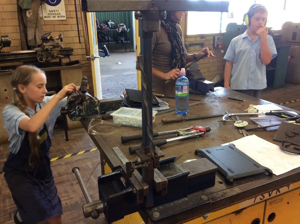 Then get the other piece of metal and put it in the twister maker and twist each side accept the middle of the metal.