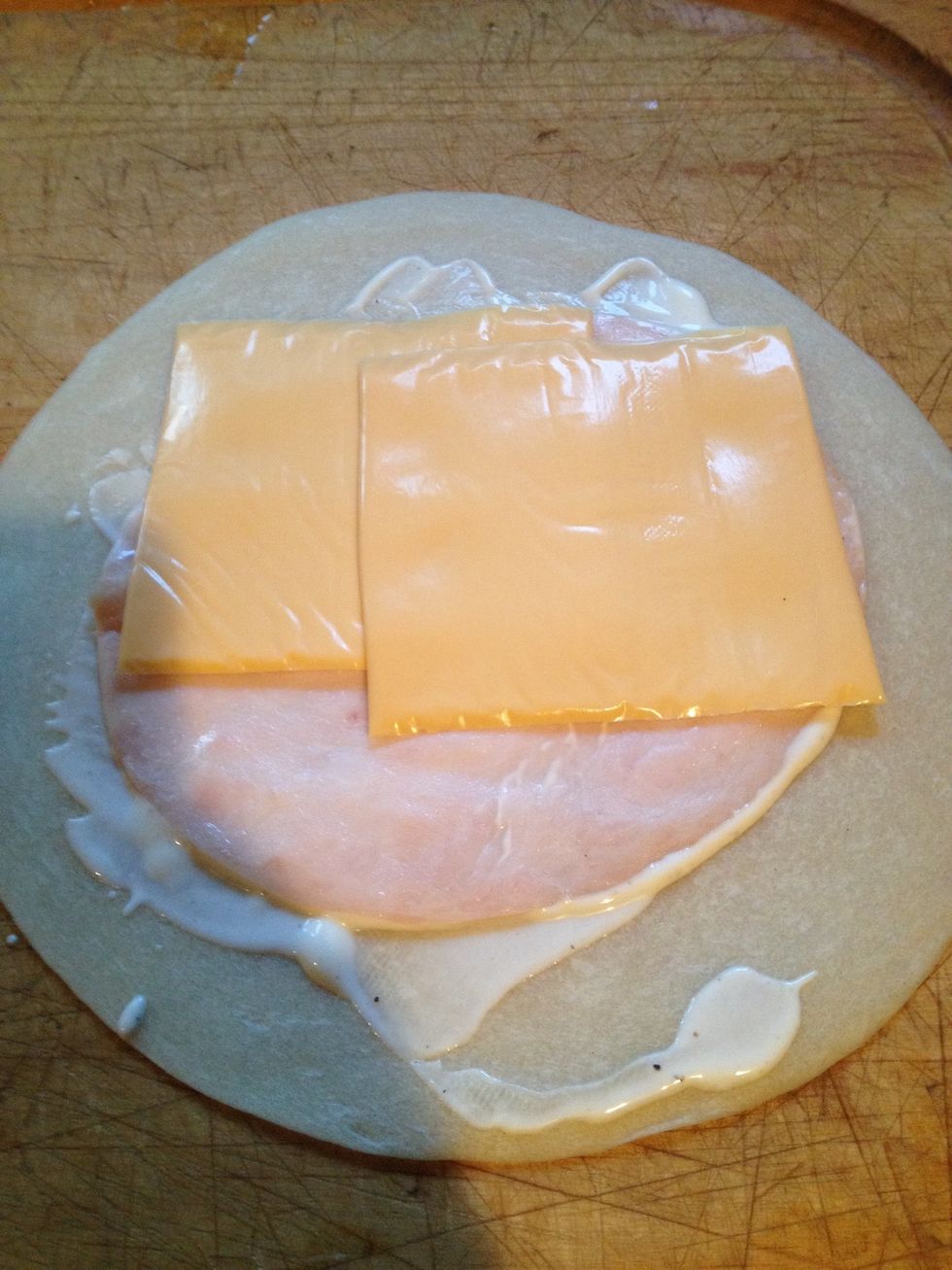 Then get two slices of your favorite cheese and put to the center