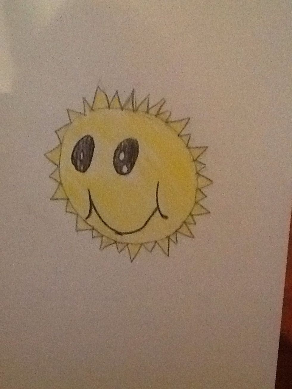 Then get yellow and lightly start coloring.next you are going to get black and trase the smile and eyes