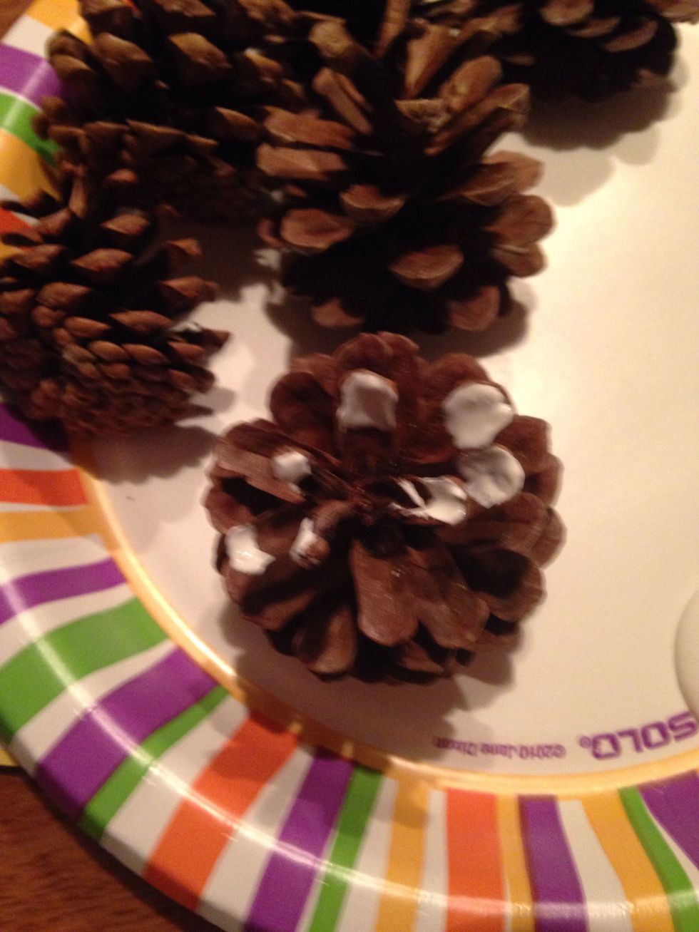 Then get your paint brush and pine cones and paint the tips