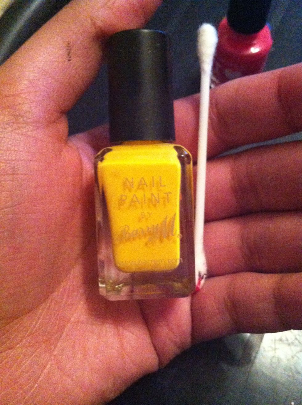 Then get your yellow varnish, use the same cotton but just the other end so as not to waste them. Do the same with the yellow, slightly coat with the varnish then dab to get off any excess