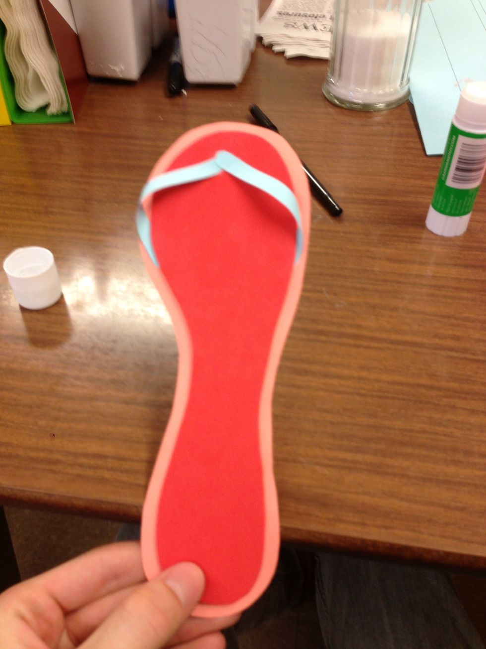 Then glue 2 strap like pieces of paper to the sides and middle of flip flop but leave the straps "open" so that it gives the flip flop effect.