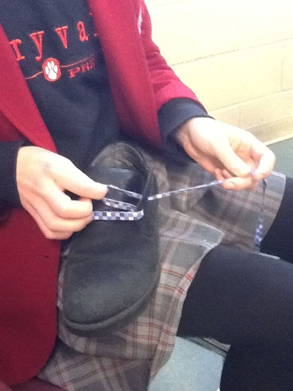 Then go to the next whole above on the same side and pull it from the outside (remember the pattern: under and over)