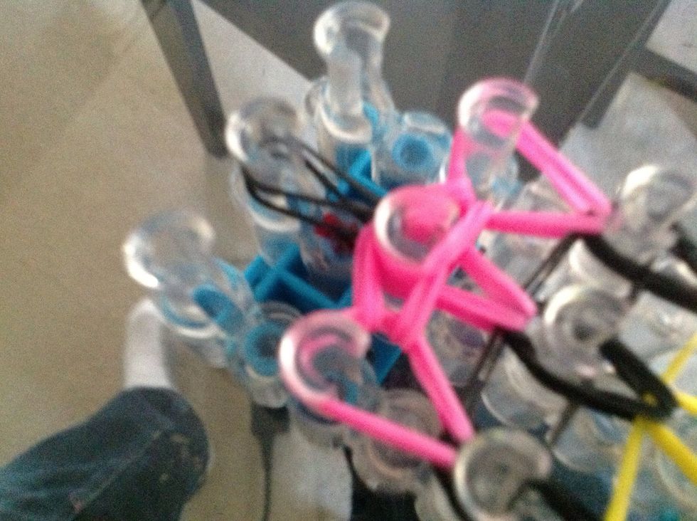 Then go under the cap bands and get that one black band and hook it over