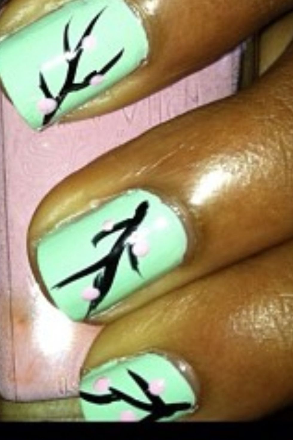 Then grab a baby pink polish(I'm using "tickled pink" by wet n'wild) and a dotting tool or a toothpick, you can also use a bobby pin.Make pink dots on the branches