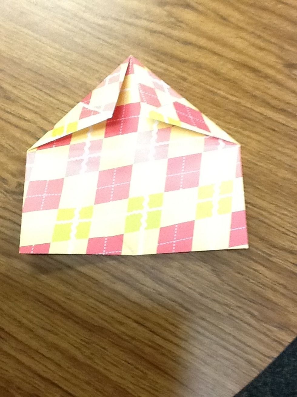 Then grab another corner and fold it to the middle.